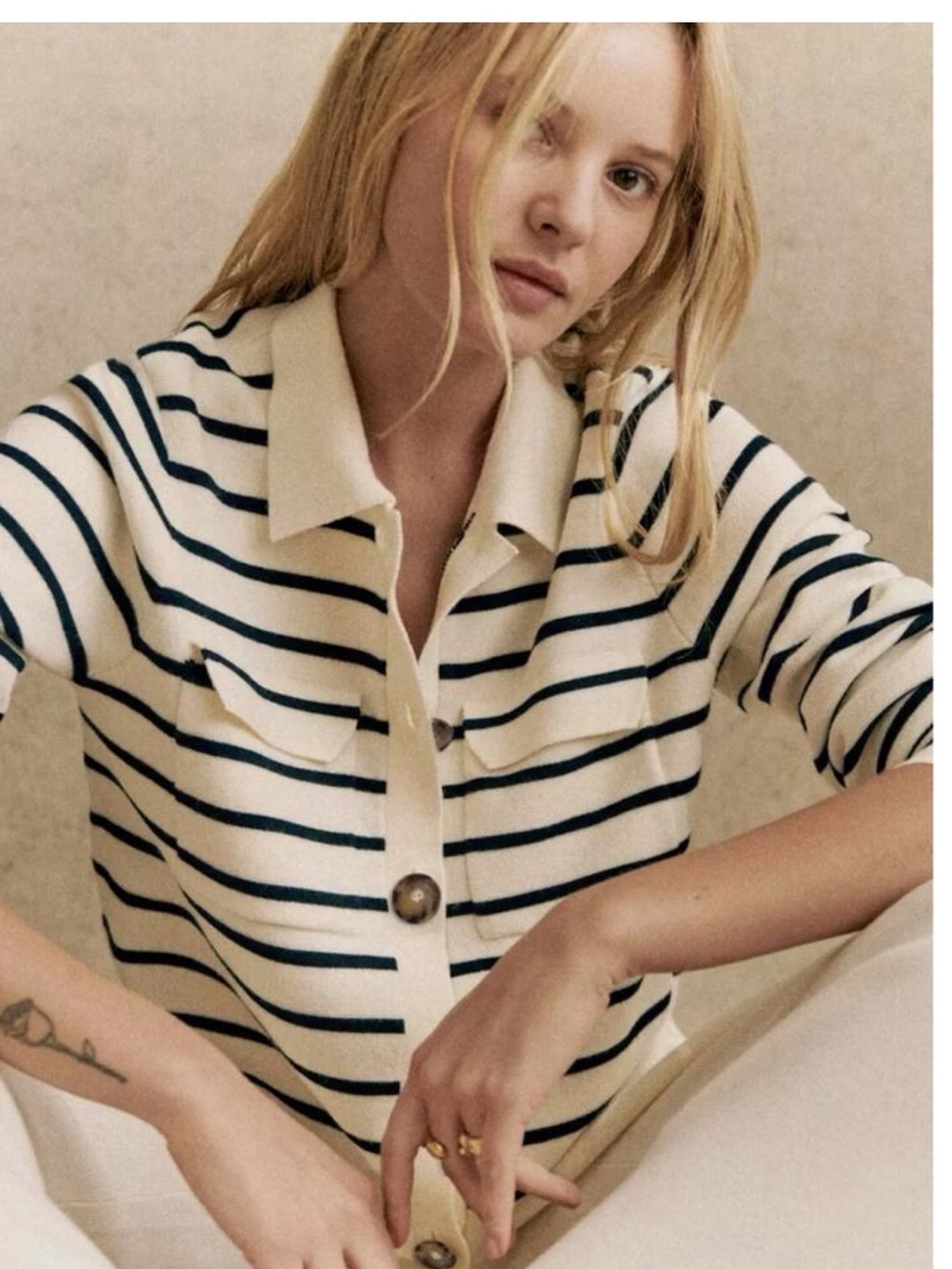 Sézane Betty Cardigan in a cream and navy striped merino wool knit.